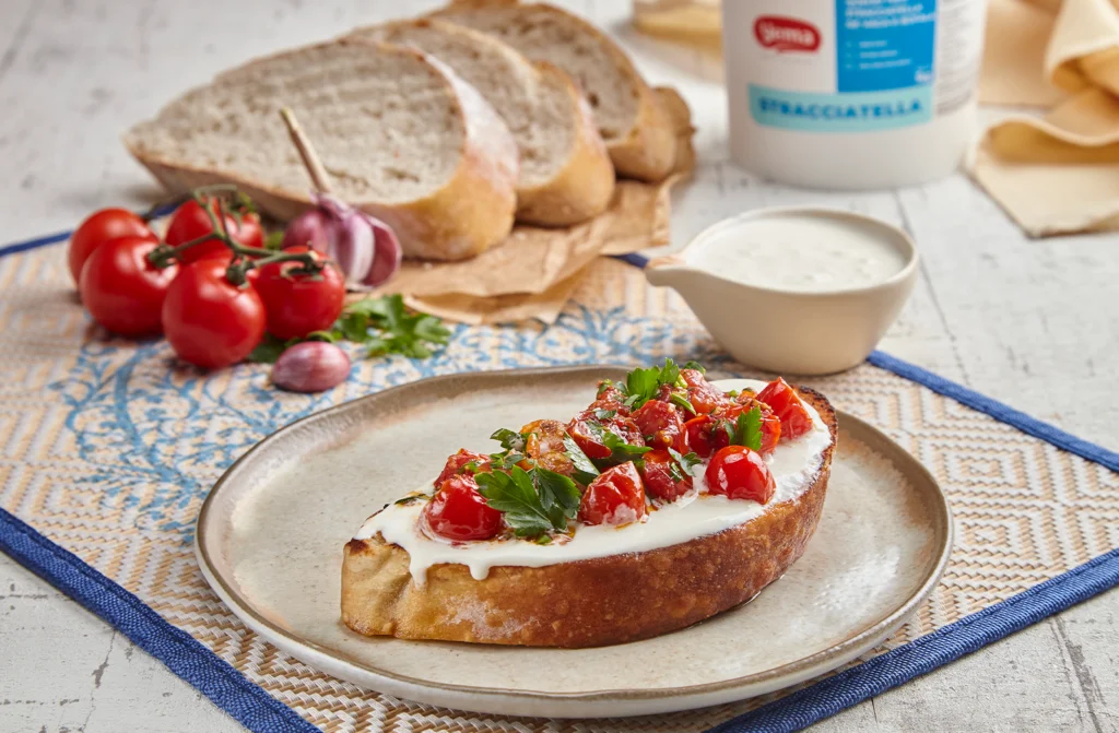 Receitas com Straciatella: Bruschetta de Stracciatella com Tomatinhos Confit